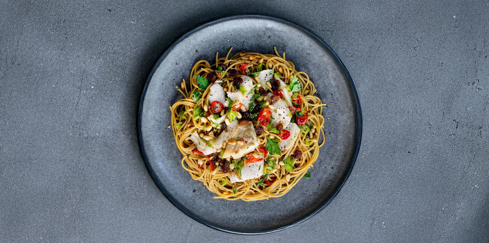 Spaghetti alla chitarra with Norwegian Stockfish, chili, raisins and pine nuts