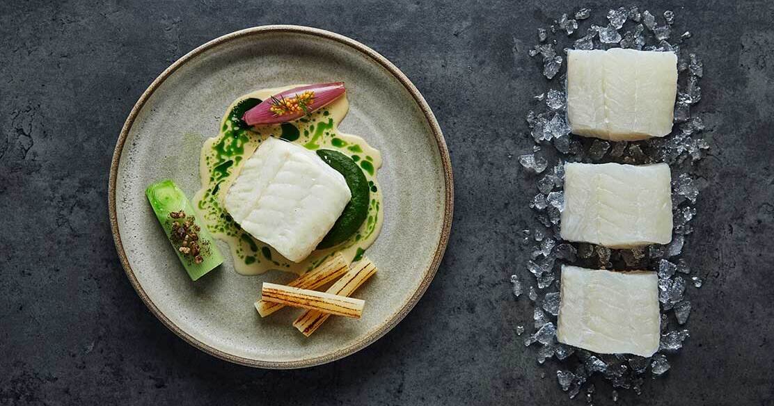 Baked Norwegian cod with vegetables and a creamy blue mussel sauce ...