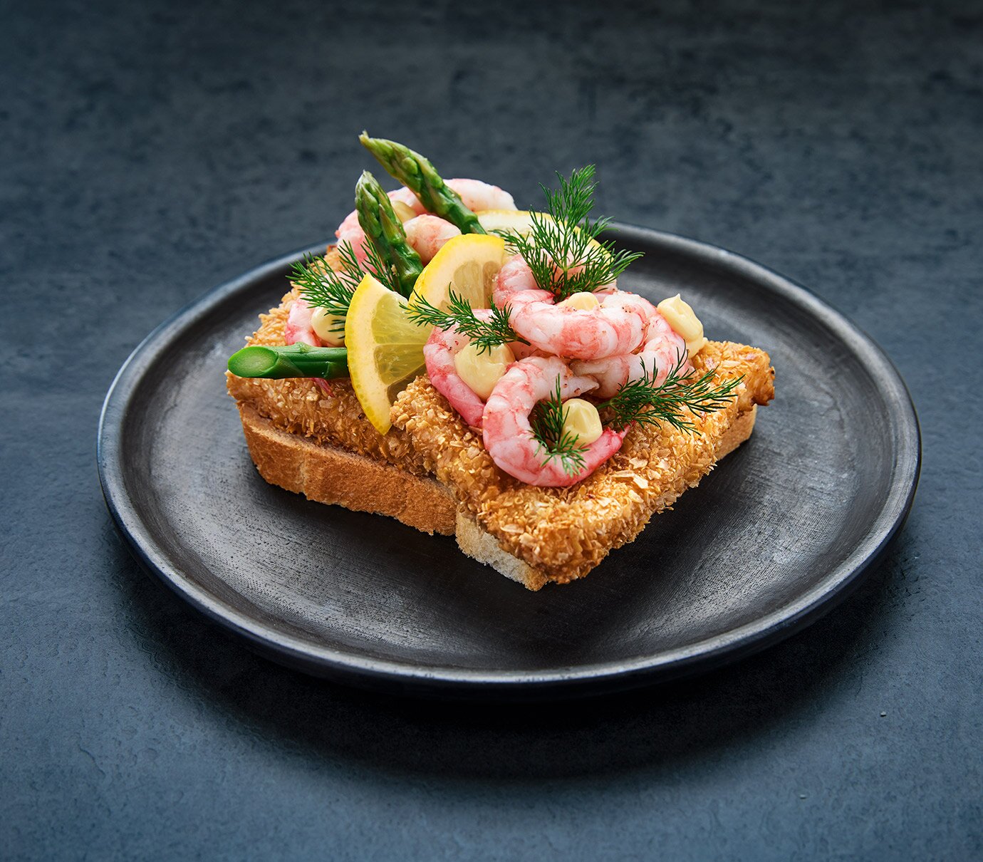 Pan-fried cod with prawns on white bread