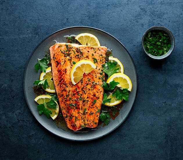 Grilled Norwegian fjord trout with lemon and herb marinade