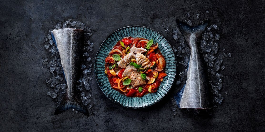 Tomato and saithe stew with vegetables