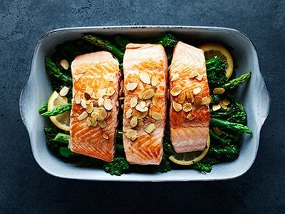 Baked salmon with broccolini and almonds