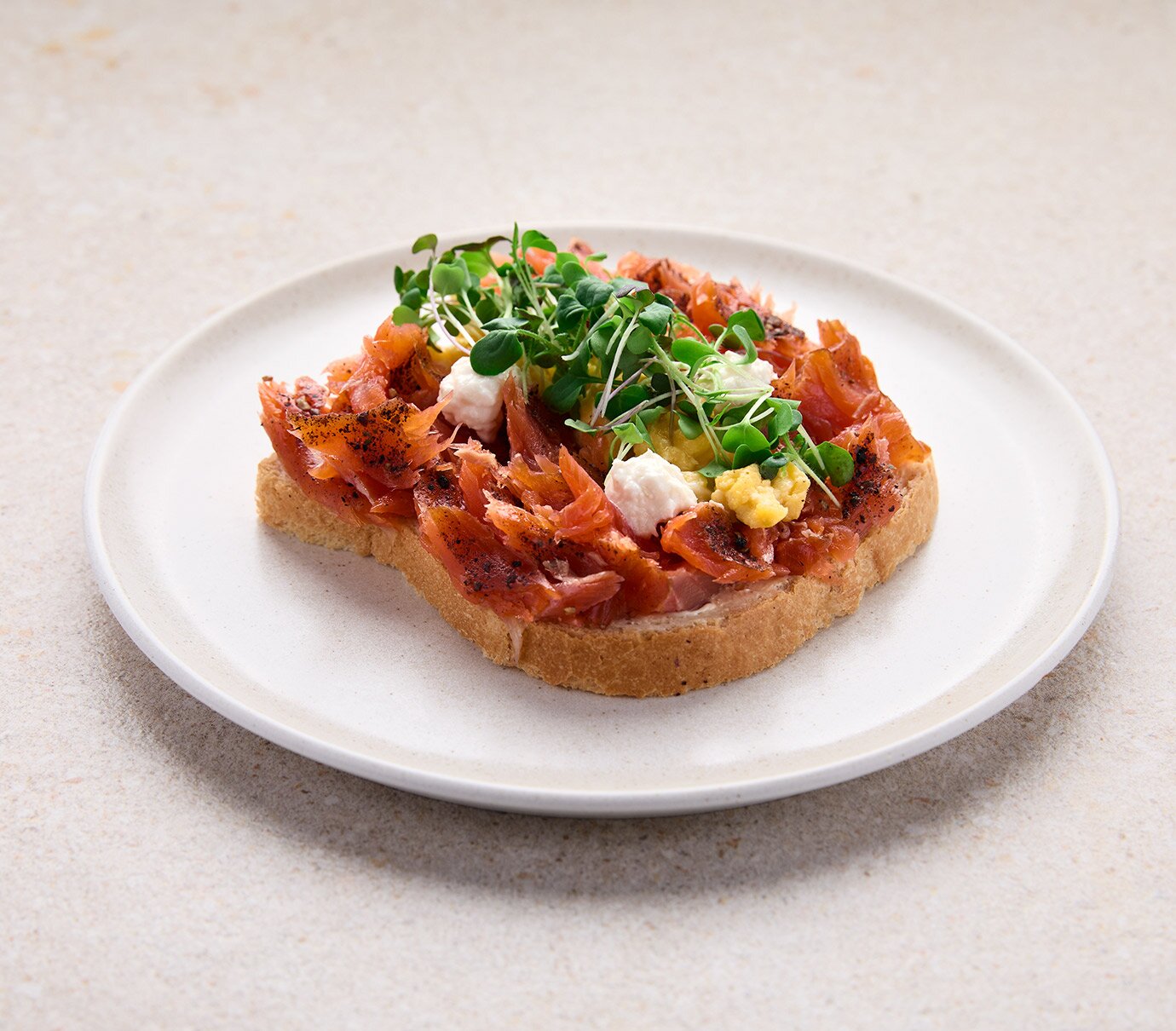Pulled salmon on toast with scrambled eggs