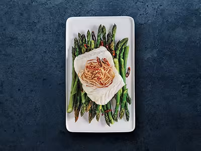 Norwegian Skrei on a bed of asparagus