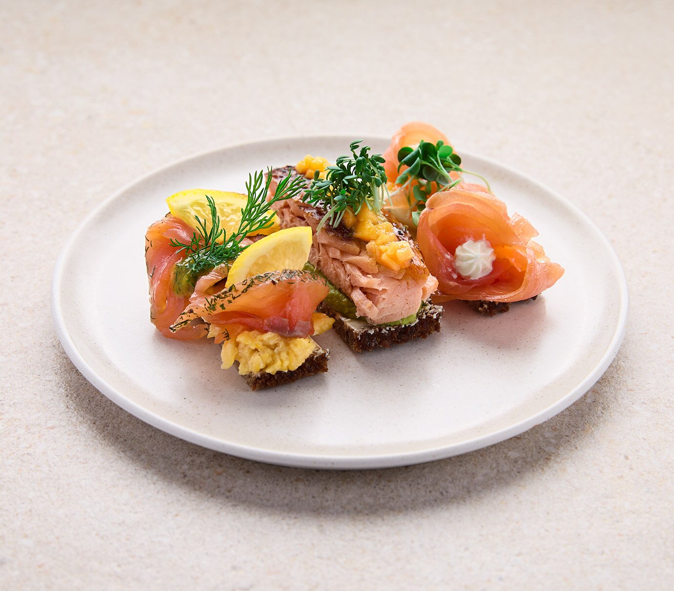Three kinds of salmon on rye bread