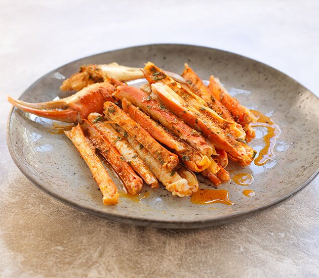Oven-baked snow crab with herb butter