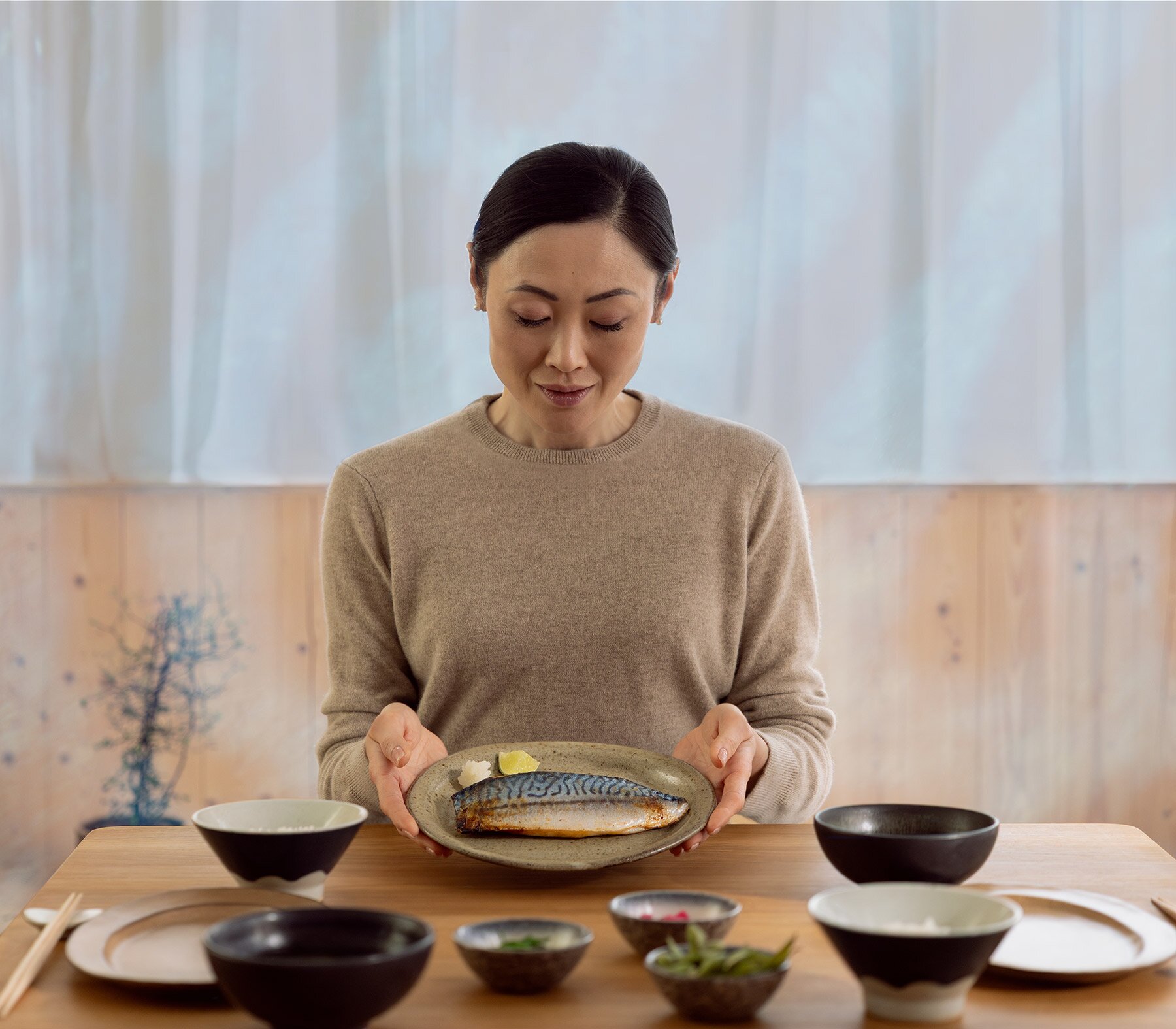 Woman eating mackerel