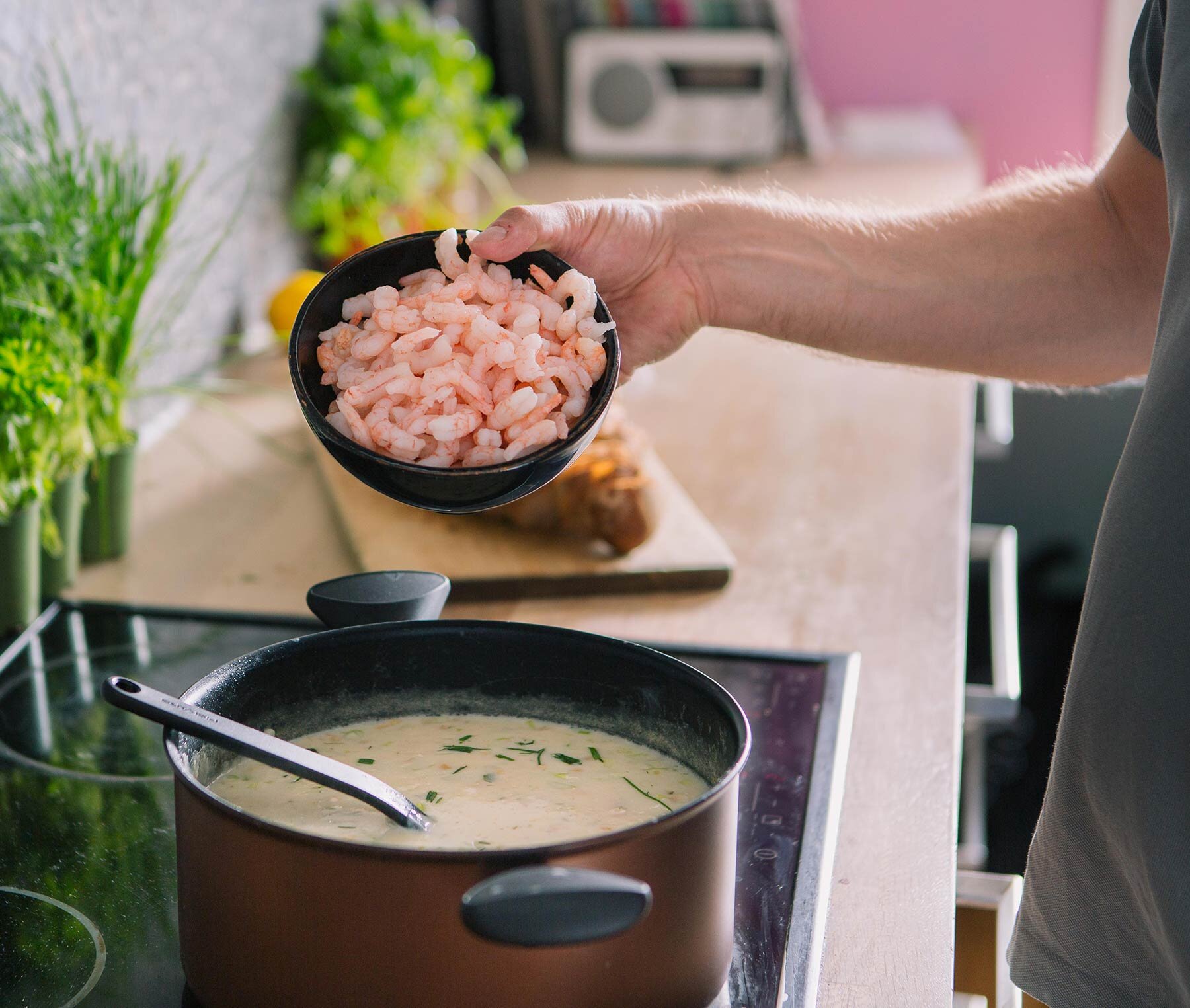 Preparing prawn soup in the kitchen