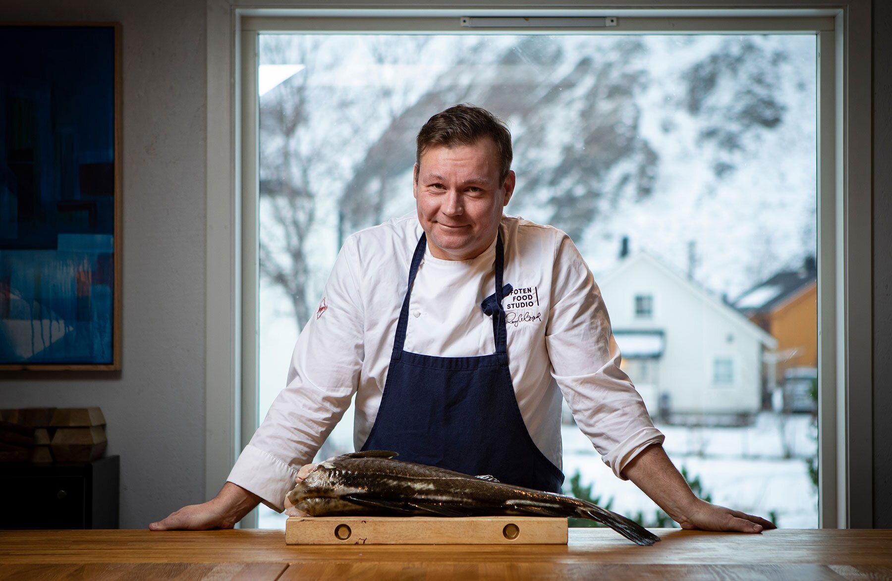 Chef Roy Magne Berglund preparing skrei in the kitchen